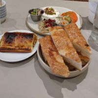 Vegan sausage roll plus 3 dips with bread delicious but would be more economical to buy individual dips with bread separately at Medina in Aberystwyth