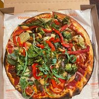 11 inch pizza with lots of veggies, roasted garlic cloves, vegan cheese and sausage, and arugula. at Blaze Pizza in Santa Barbara