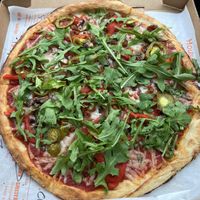 11 inch build your own pizza with vegan cheese, vegan chorizo, mushrooms, peppers, jalepenos, and arugula   at Blaze Pizza in Santa Barbara