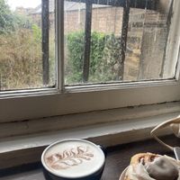oat milk chai latte & vegan cinnamon bun  at Lovecrumbs - West Port in Edinburgh