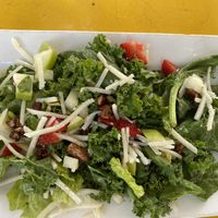 Vegan salad with kale,strawberries, pecans, and vegan cheese. Delicious! at The Vault in Tulsa