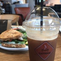 Ice Ginger Ale Coffee - a very tasty and refreshing sparkly coffee coctail, and a vegan cheese in the background at Caffeine Roasters in Tampa