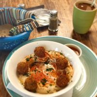 Hummus with extra falafel and corn tortillas (usually pita bread but wasn't available that day), free instant coffee with soy milk at Zoola in San Pedro La Laguna