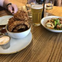 Apps: Crispy Dumplings and Puffed Quinoa Onion Rings. Fantastic!  at Fresh on Spadina in Toronto