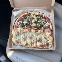 Take two/ vegan build your own with balsamic drizzle and vegan cheesy bread!   at Blaze Pizza in Kalamazoo