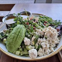 eat your greens topped with avocado and vegan feta at Fresh Kitchen + Juice Bar in Toronto