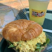 Curry chickpea salad with golden raisins topped with arugula. So delicious….highly recommended! at The Juice Garden in Fremont