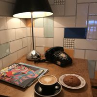 Cappuccino with oat milk and cranberry oat cookie at Paquebot - St Laurent in Montreal