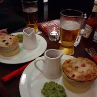 Jackfruit "steak" pie with mash gravy and mushy peas at The Barley Mow in London