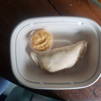 empanada with dip at Rise Authentic Baking Co in Grand Rapids