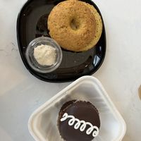 Mostess cupcake (bottom), garlic and cheese bagel with cashew cream cheese (top)   at Rise Authentic Baking Co in Grand Rapids