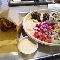 Rice Bowl with Falafel (Baba ganoush and various pickles) with side of Spiced Cauliflower and tahini to dip. at Bezoria - Cumberland in Atlanta