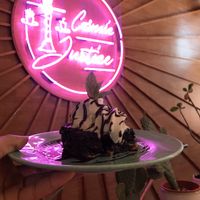 Brownie with coconut ice cream  at Genesis Plant Based Alchemy in North London