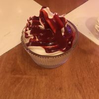 Vegan soft serve with raspberry sauce  at Genesis Plant Based Alchemy in North London