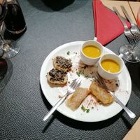 Nice greeting from the kitchen, pumpkin soup, bread with tapenade and spring roles at Au Goût du Jour in Eupen