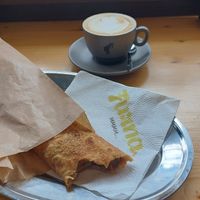 Apple, walnut and cinnamon banitsa with a very good oat cappuccino. at Furna in Sofia