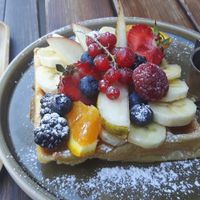 Vegan waffle with fruit and syrup. at Cafe Nomad - Weststadt in Heidelberg