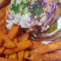 The vegan "chicken" burger with vegan slaw, pesto, vegan mayo, pickles and tomato served with sweet potato fries 😍😍😍 at Harvest Room in Munster