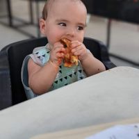 My little enjoying her slice of pie.  at &pizza in Gaithersburg