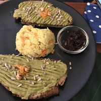Avocado toast served with rice and dried tomato relish at Imagine Café in Paris