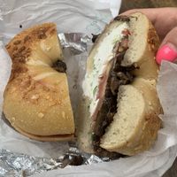 Onion bagel with tofu scallion cream cheese with sautéed mushrooms and tomato at Toast & Roast Bagels and Coffee in Astoria