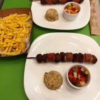 Espetinhos e batata frita com cheddar at Açougue Vegano - Ipanema in Rio De Janeiro