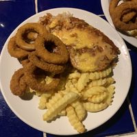 Parmigana and onion rings  at Açougue Vegano - Ipanema in Rio De Janeiro