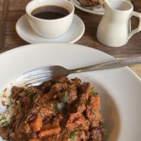 Chickpea and rice curry. Oat fruity bar and coffee with oat milk. Lovely.   at The Good Earth in Wells