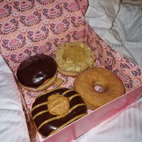(Clockwise from top left) Boston creme, apple pie, cinnamon sugar, peanut butter fudge at Brammibal's Donuts - Potsdamer Platz in Berlin