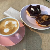 Vanilla cream + Peanut butter donuts, and cappuccino at Brammibal's Donuts - Potsdamer Platz in Berlin