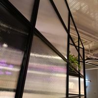 Interior facing seating area across from counter at Brammibal's Donuts - Potsdamer Platz in Berlin