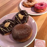 2 chocolate peanut butter, espresso, hibiscus and maple coconut bacon!!! at Brammibal's Donuts - Potsdamer Platz in Berlin