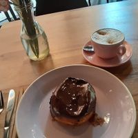 Boston cream donut and cappuccino at Brammibal's Donuts - Potsdamer Platz in Berlin