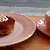 Tiramisu donut and cappuccino at Brammibal's Donuts - Potsdamer Platz in Berlin