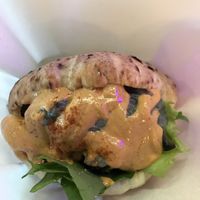 A shot of the “brother’s sandwich” with spicy sesame dressing, and various fillings/toppings  at Falafel Brothers - Ebisu in Tokyo