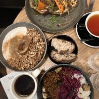 Ricotta toast, granola bowl, and the bowl of the moment with their coffee and some tea #Veganuary at Grounded in Paris