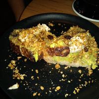 Avocado toast with granola topping at Grounded in Paris