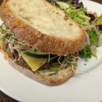 Lentil burger with side salad at Broadfork Cafe - Uptown in Seattle