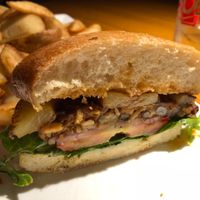 Oasis burger with a chipotle bean patty, tomato, grilled pineapple, lettuce, sweet chili sauce, and vegan mayo at Bob's Burgers and Brew in Marysville