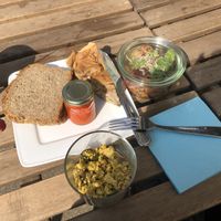 Tofu scramble, quiche, potato salad with apple and beets and bell pepper cream  at Kune in Leipzig