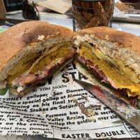 On a fresh grilled bun, grilled pineapple, tomato, chickpea and veg homemade pattie with homemade relish and vegan mayo, spinach and tomato! I’ll be back for another!!   at Farmer & Sun in Gympie