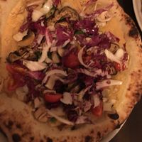 Vegan pizza with chickpea base at Stranero in Berlin