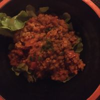 Coral lentil stew seasoned with curry powder at A Casa di l'orsu in Corsica