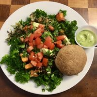 Build your own bowl with kale, brussels, mushrooms, cilantro, tomatoes, avocados, and a plain roll. at Sweet Elizabeth's Organics Bakery in Colorado Springs