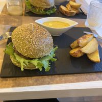 Sweet mustard burger with baked potatoes and ginger lemonadee  at Sublimmme in Bucharest