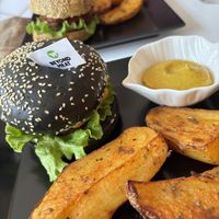 Beyond burger with baked potatoes and the house BBQ burger.  at Sublimmme in Bucharest