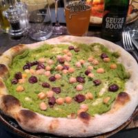 Vegan pizza with broccoli, chickpeas & olives at Amuni in Bruges