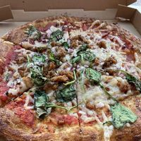 Vegan cheese, tomato sauce, beyond crumbles, red onion and spinach at Oath Pizza in Somerville