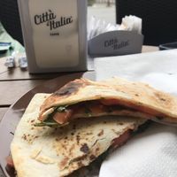 Italian flatbread with tomatoes and greens at Cup's Italian Coffee House in Zermatt