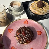 Pancakes with vegan Nutella and strawberries & waffle with banana and vegan B&J brownie icecream at Creme Cafe in Lanzarote